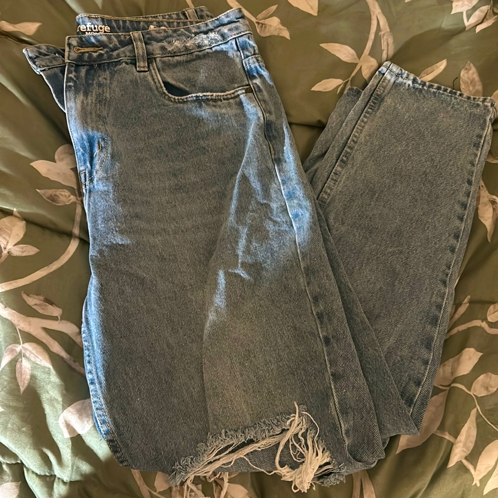 Light ripped blue jeans